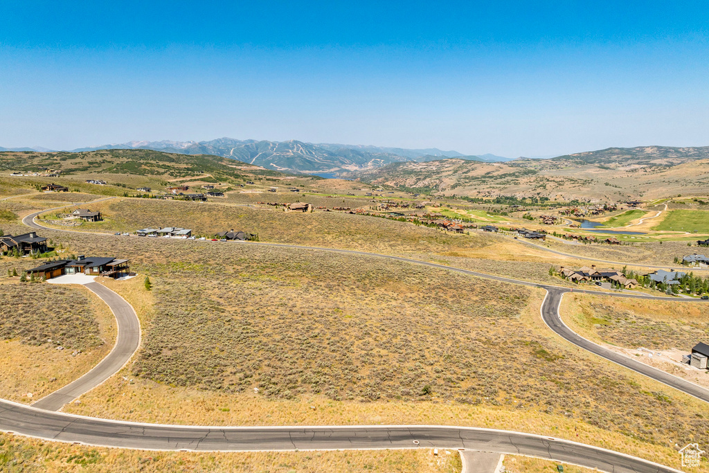 Birds eye view of property with a mountain view