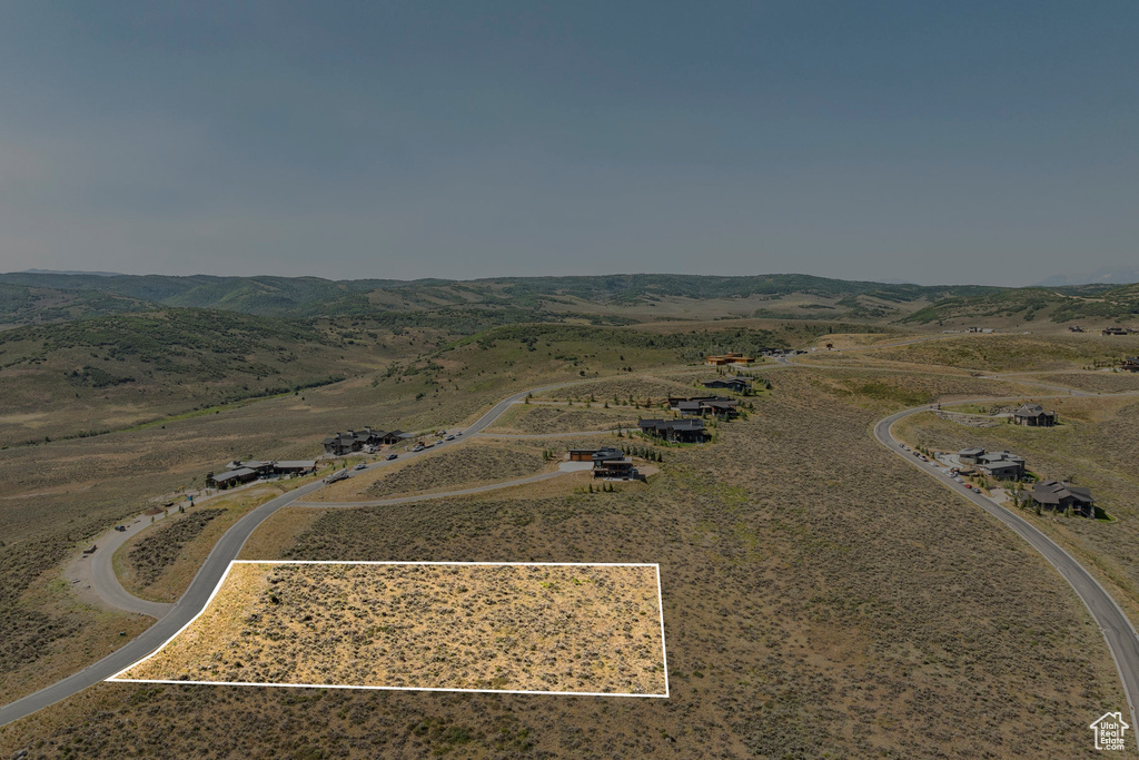 Aerial view featuring a rural view and a mountain view