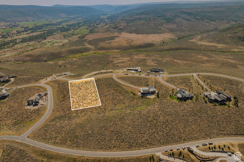 Birds eye view of property with a rural view and a mountain view