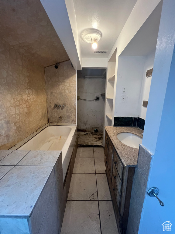 Bathroom featuring vanity and tile patterned flooring