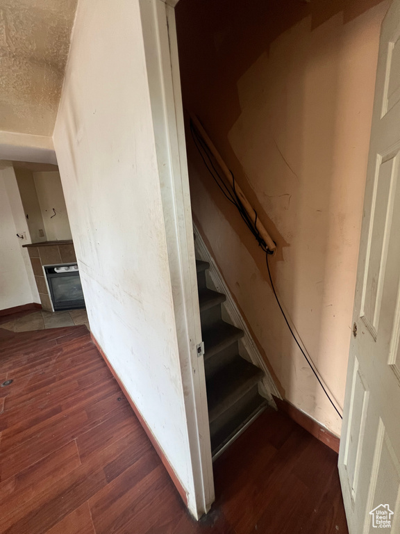 Stairway with hardwood / wood-style floors