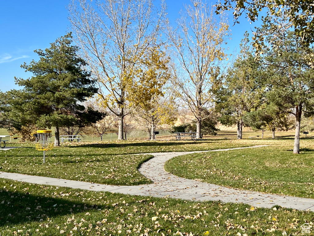 View of property\\\'s community featuring a lawn