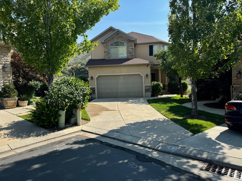 View of front of property with a garage