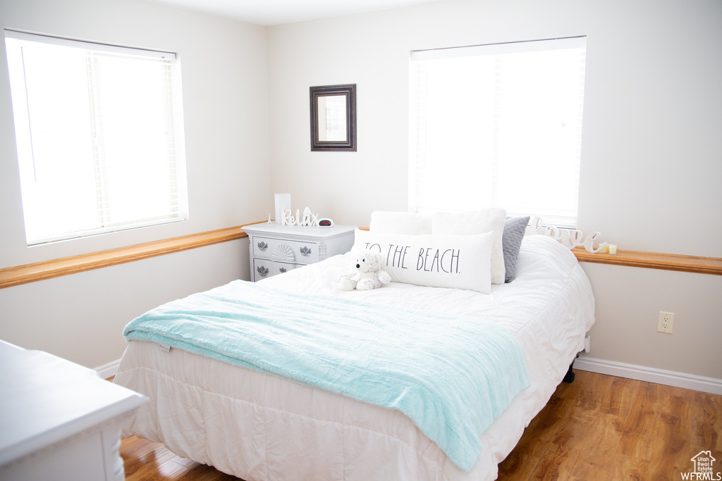 Bedroom with wood-type flooring