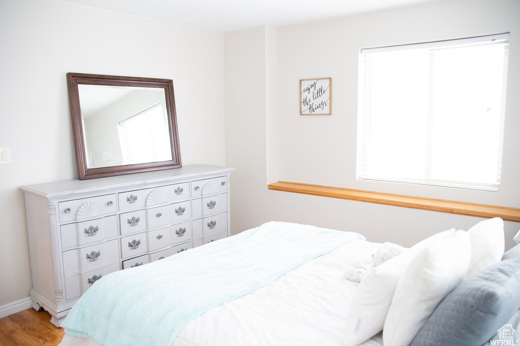 Bedroom with wood-type flooring