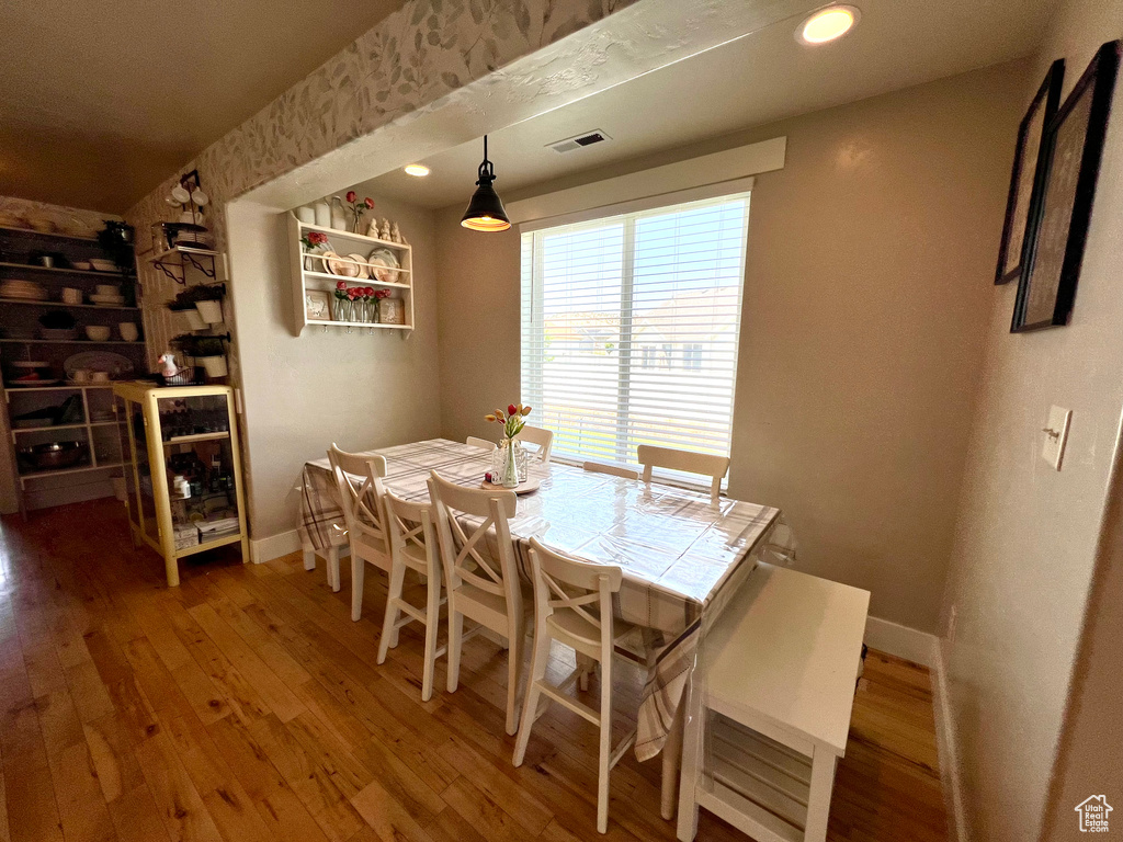 Dining room with wood-type flooring