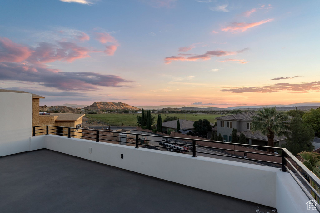 Balcony at dusk with a mountain view