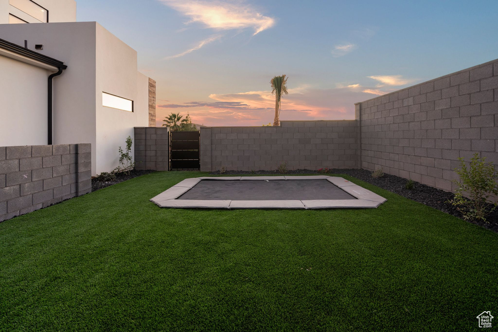 View of yard at dusk