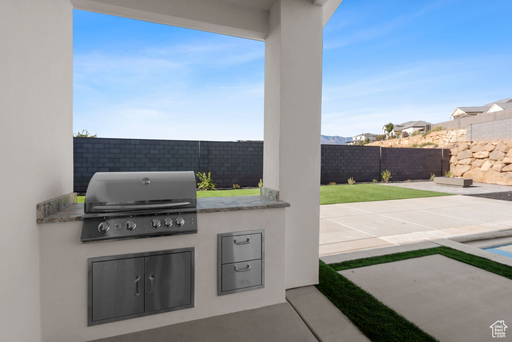 View of patio featuring area for grilling