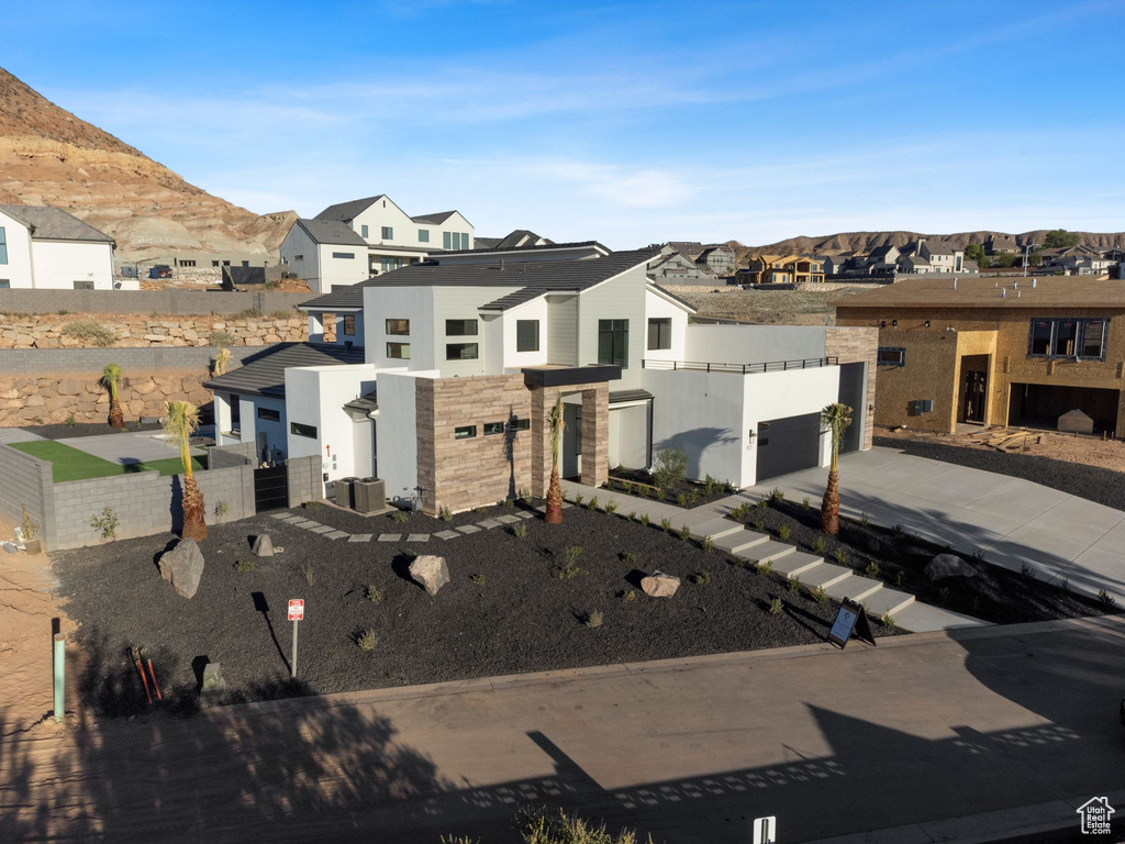 View of front of home featuring a mountain view