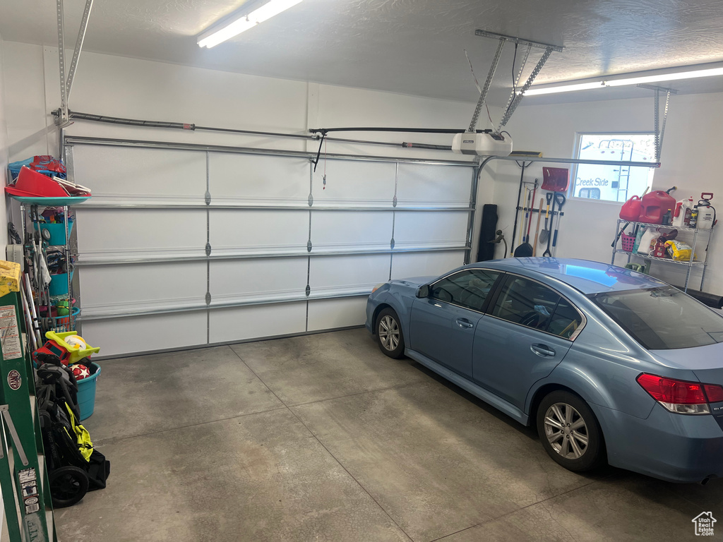 Garage featuring a garage door opener