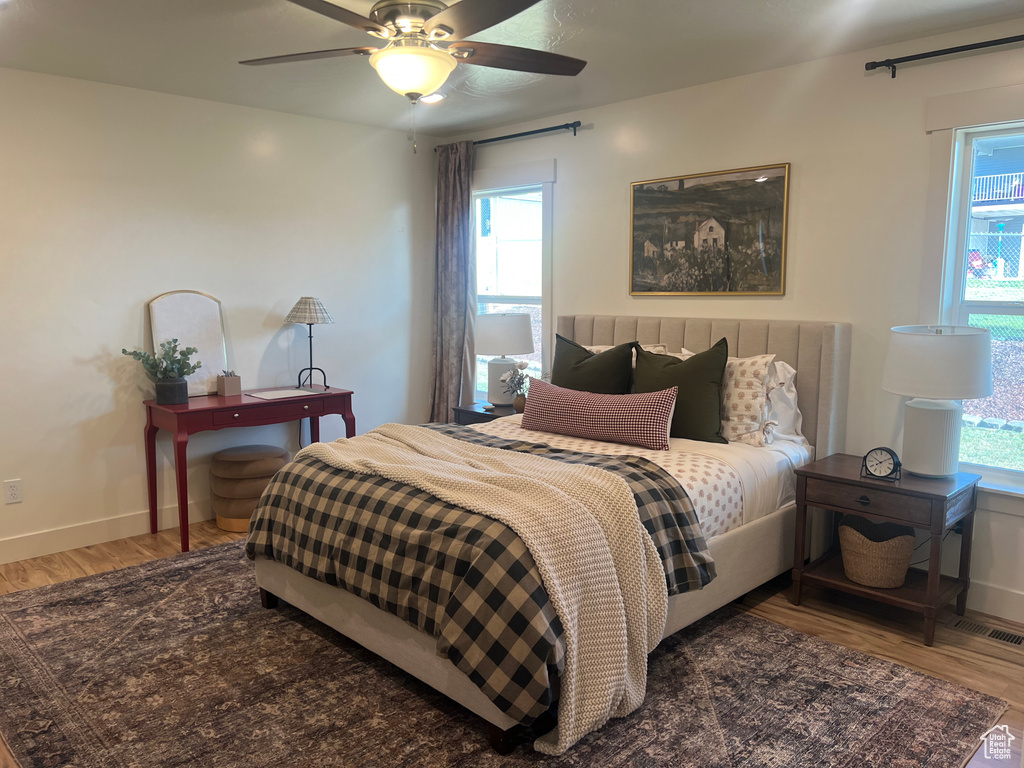 Bedroom featuring hardwood / wood-style floors and ceiling fan