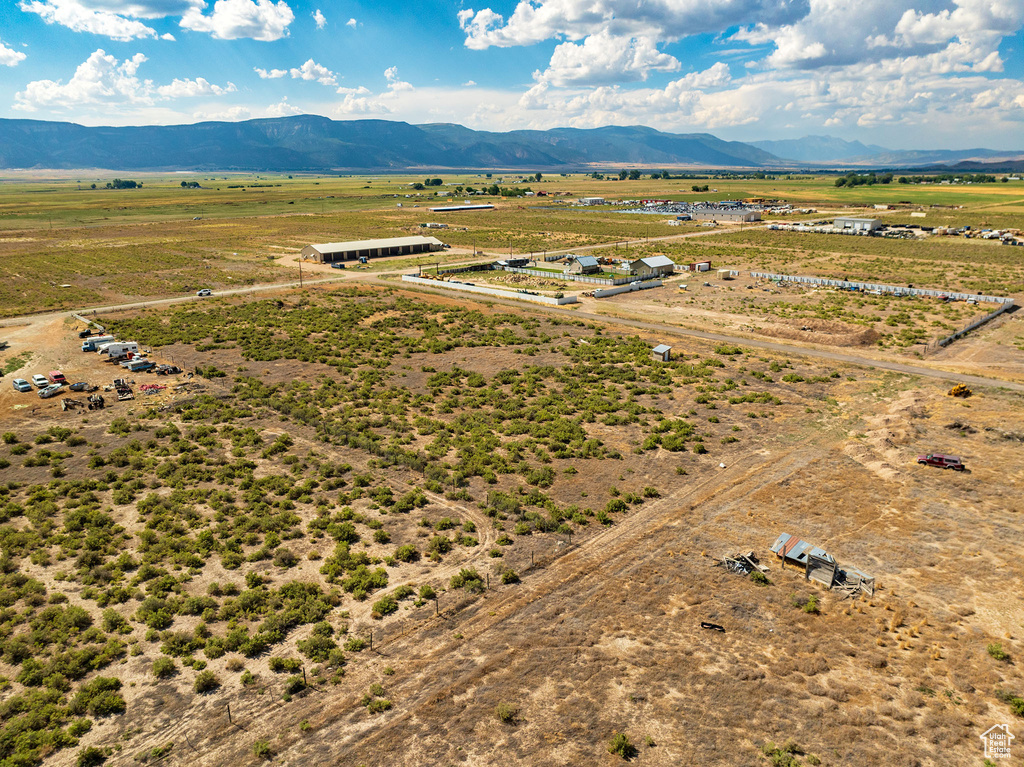 Birds eye view of property with a rural view and a mountain view