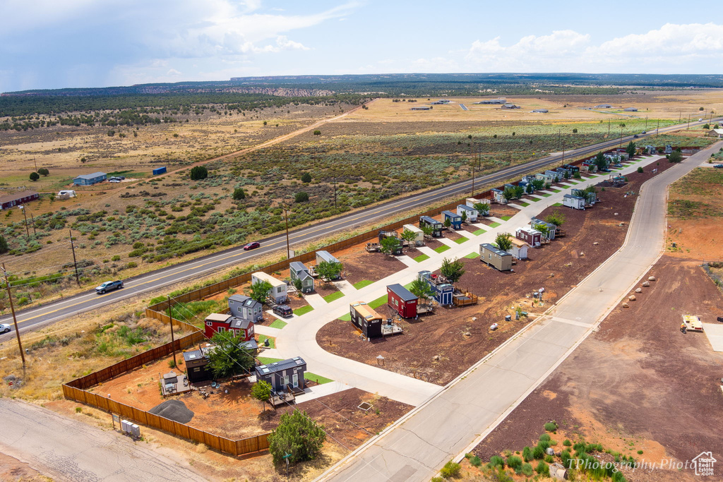Birds eye view of property with a rural view