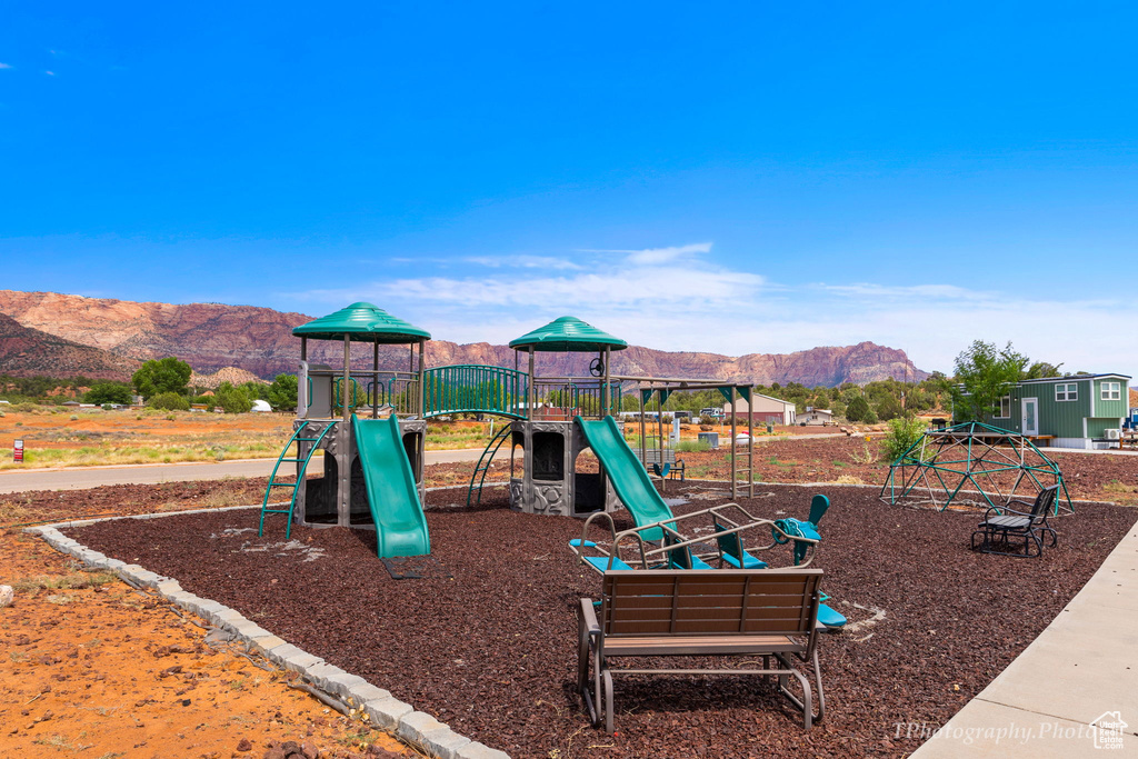 View of playground with a mountain view