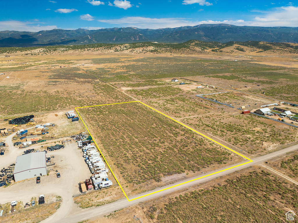 Birds eye view of property with a mountain view and a rural view