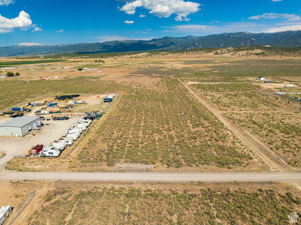 Aerial view featuring a rural view and a mountain view