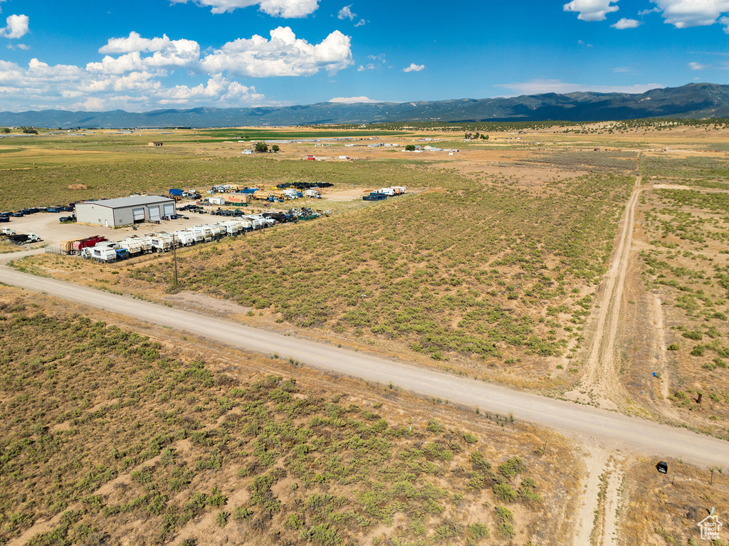 Birds eye view of property with a rural view and a mountain view
