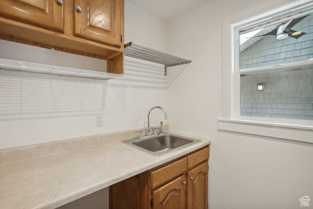 Kitchen featuring sink and ceiling fan