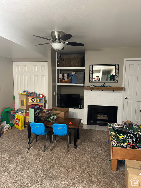 Game room with carpet flooring and ceiling fan