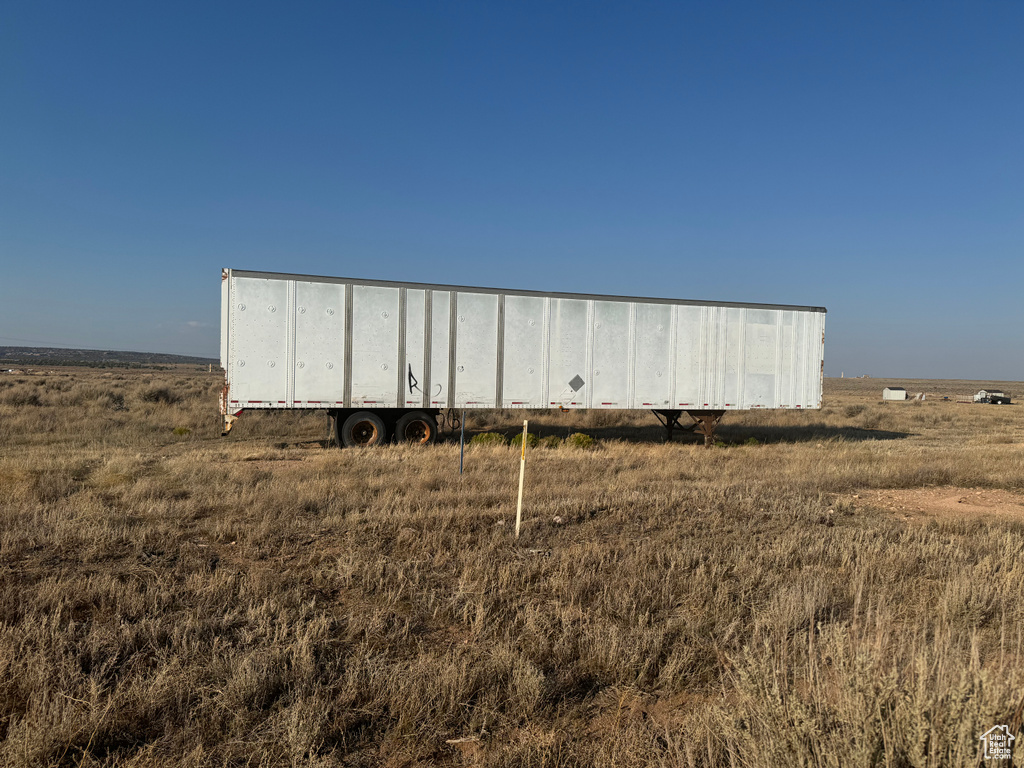 View of outbuilding with a rural view