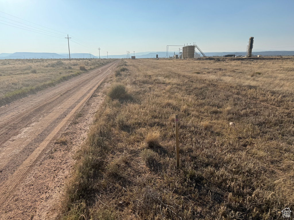 View of yard with a rural view