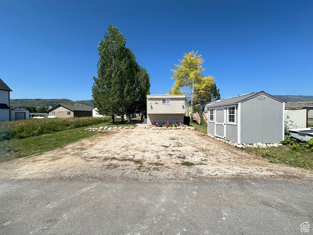 View of yard featuring a storage unit