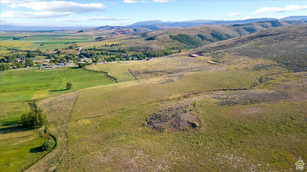 Birds eye view of property featuring a mountain view and a rural view