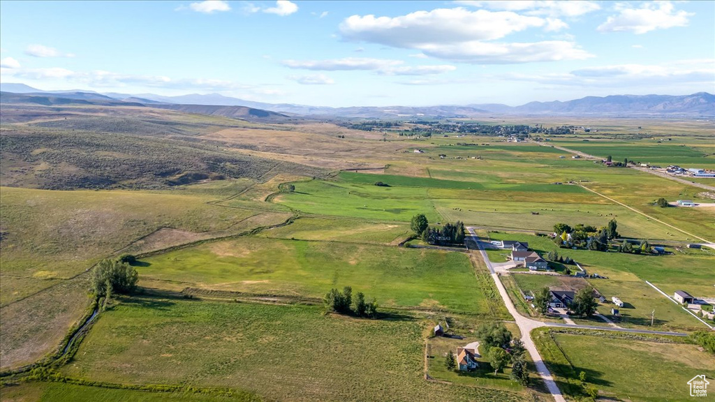 Drone / aerial view with a mountain view and a rural view