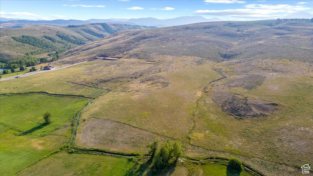 Drone / aerial view with a mountain view and a rural view