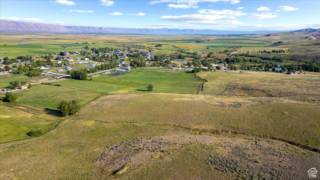 Birds eye view of property featuring a mountain view and a rural view