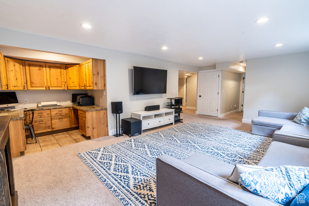 Living room featuring light carpet