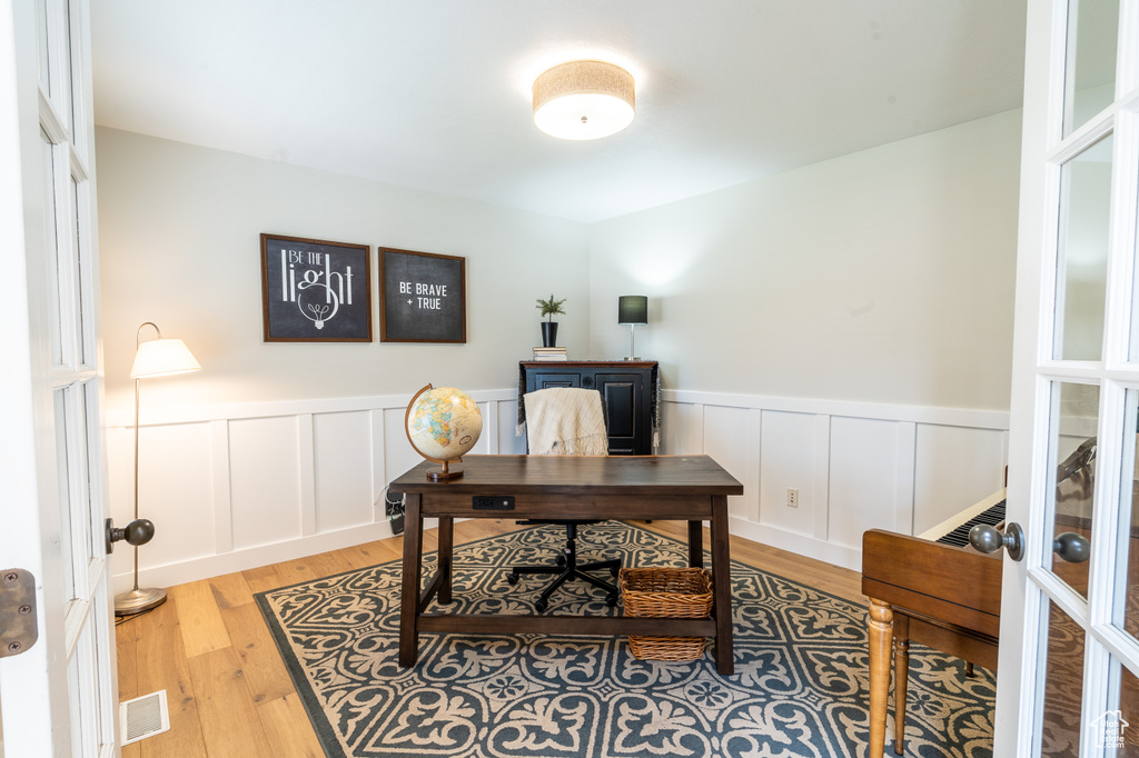 Office space featuring light wood-type flooring