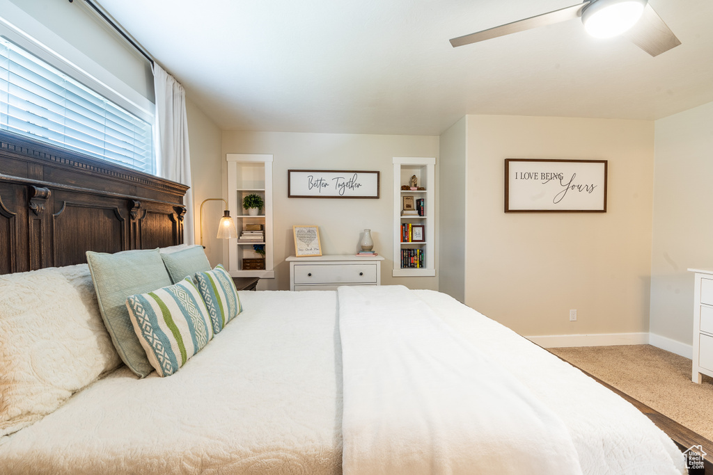 Bedroom with light carpet and ceiling fan