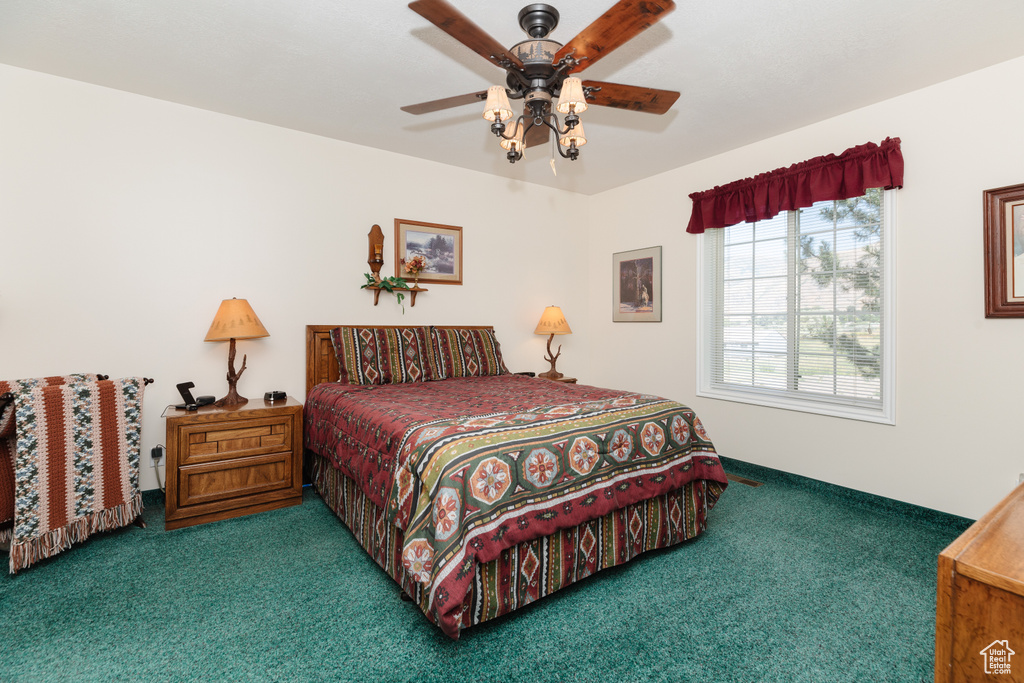 Carpeted bedroom with ceiling fan