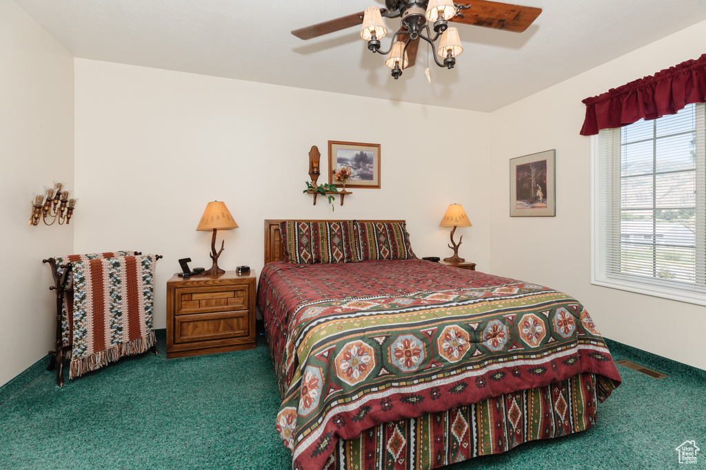 Bedroom featuring carpet and ceiling fan