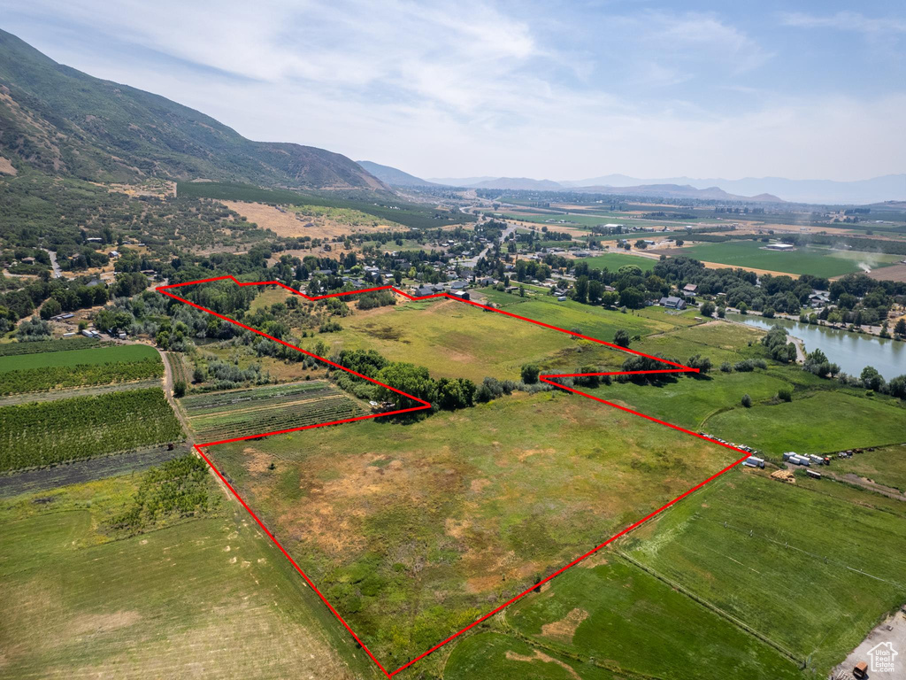 Birds eye view of property featuring a mountain view and a rural view