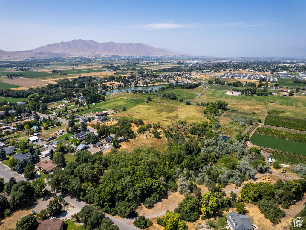 Drone / aerial view with a water and mountain view