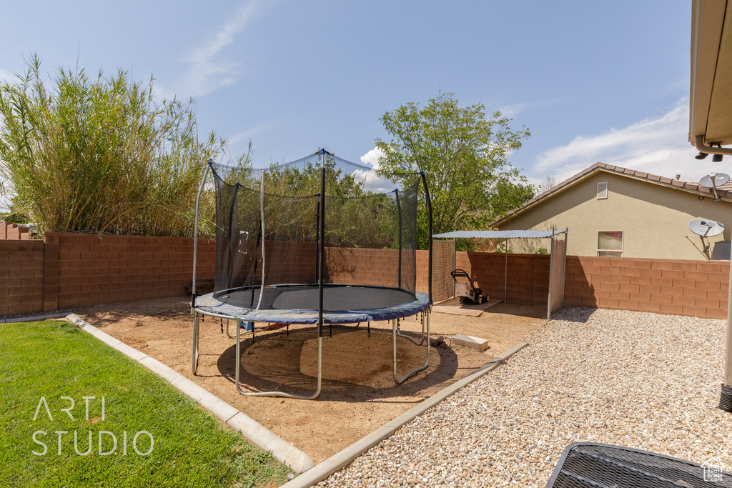 View of yard with a trampoline