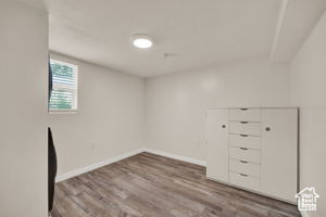 Unfurnished room with hardwood / wood-style floors