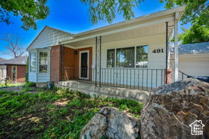 Single story home with a porch