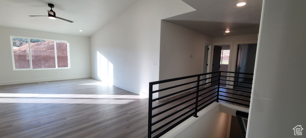 Interior space featuring wood-type flooring and ceiling fan