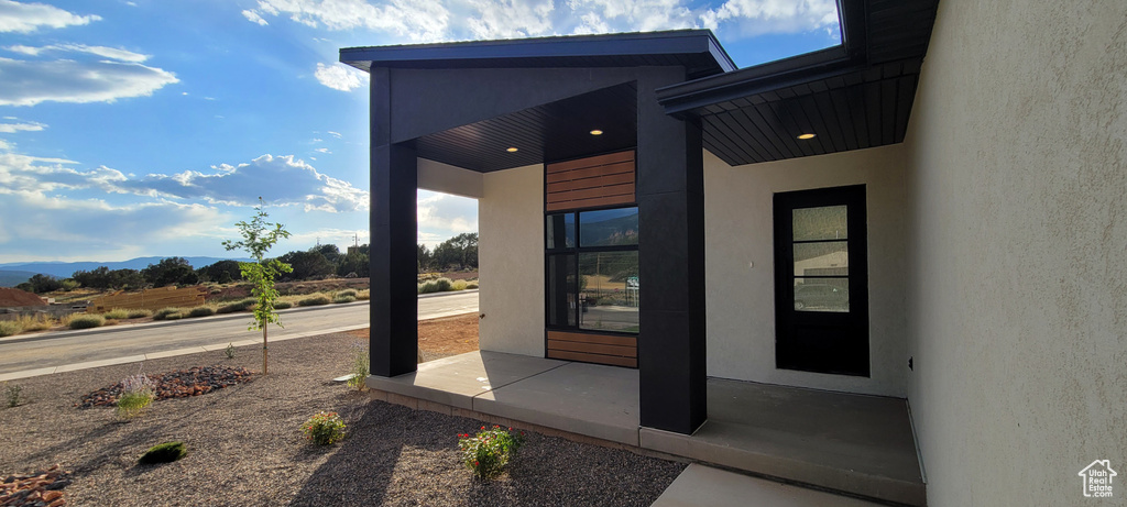 View of exterior entry featuring a mountain view