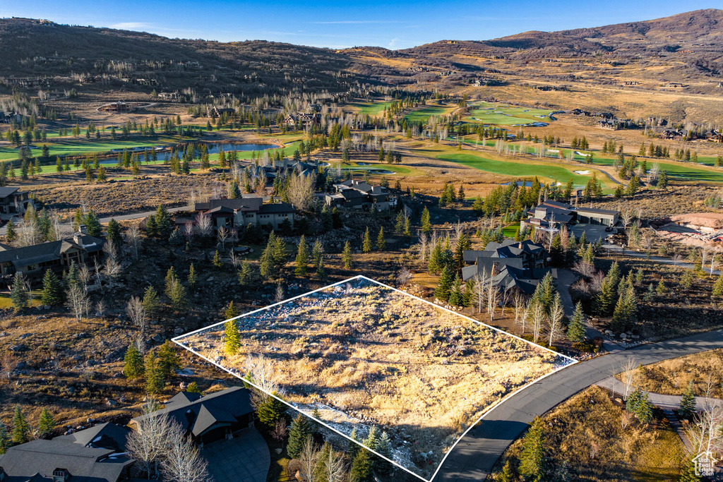 Birds eye view of property with a mountain view