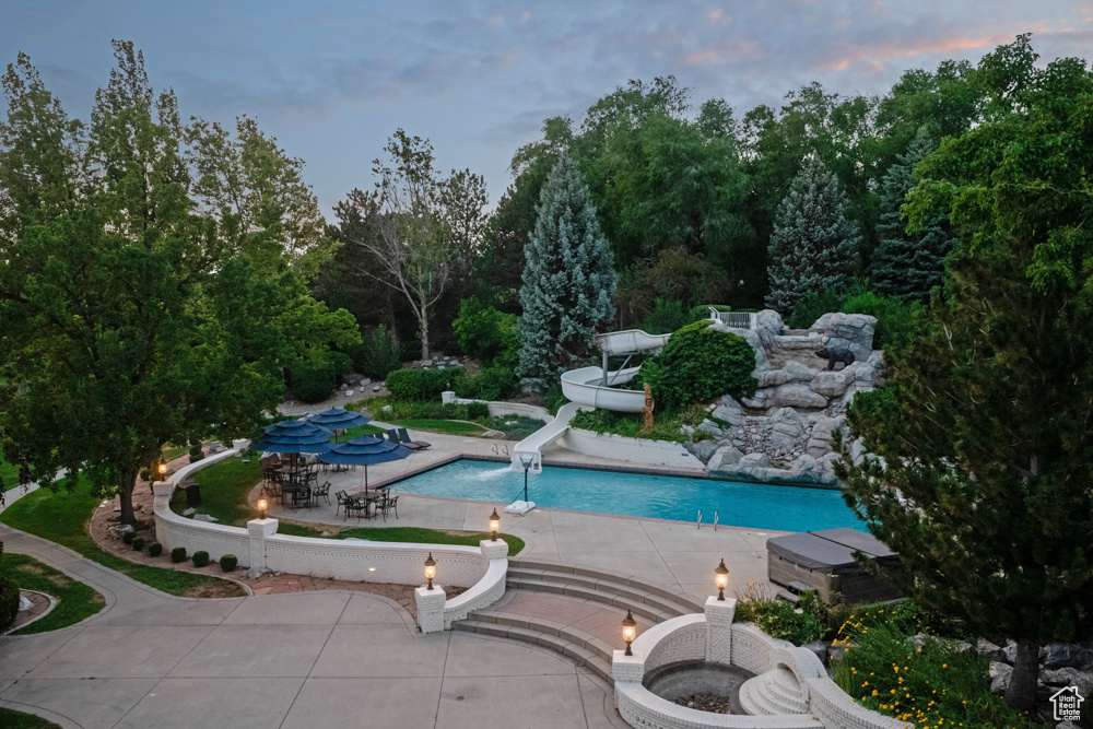 Pool at dusk with a water slide