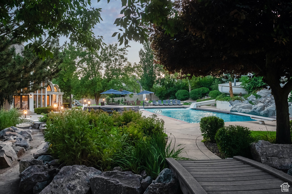 View of pool with a diving board