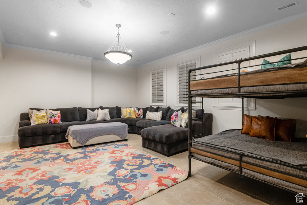 Tiled living room featuring crown molding