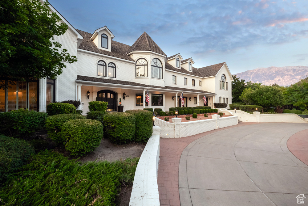 View of front of house with a mountain view and covered porch