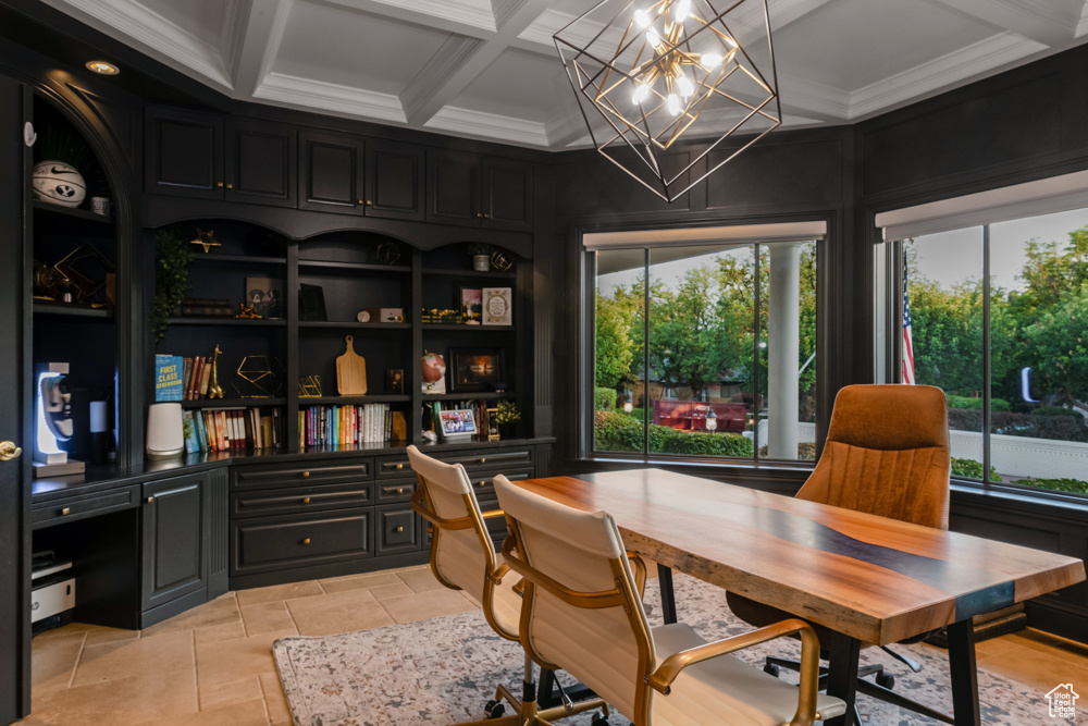 Tiled office space featuring ornamental molding, a wealth of natural light, coffered ceiling, and a chandelier