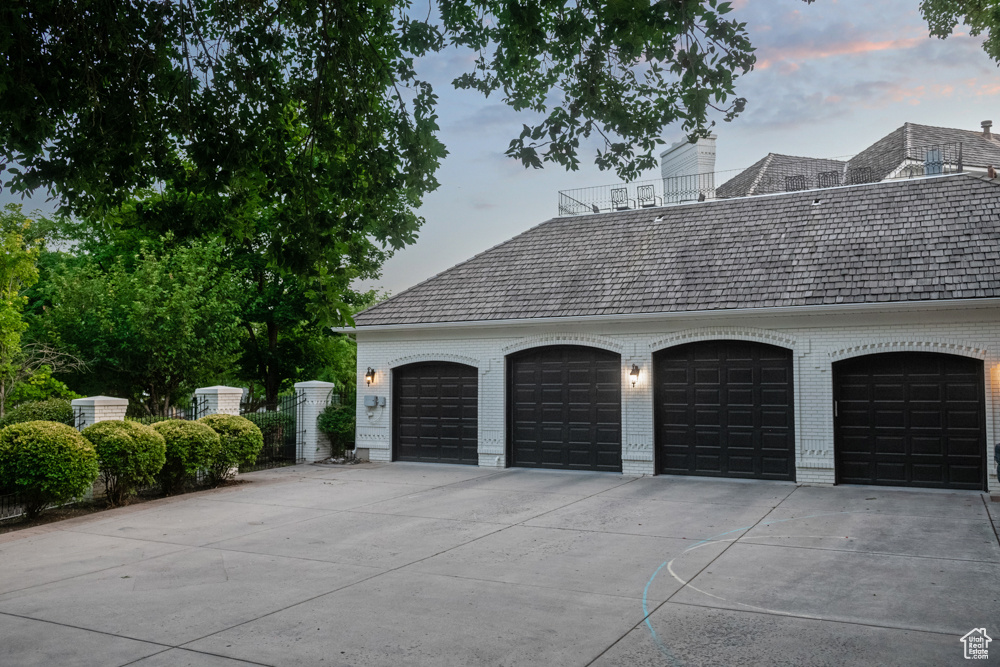 Property exterior at dusk with a garage